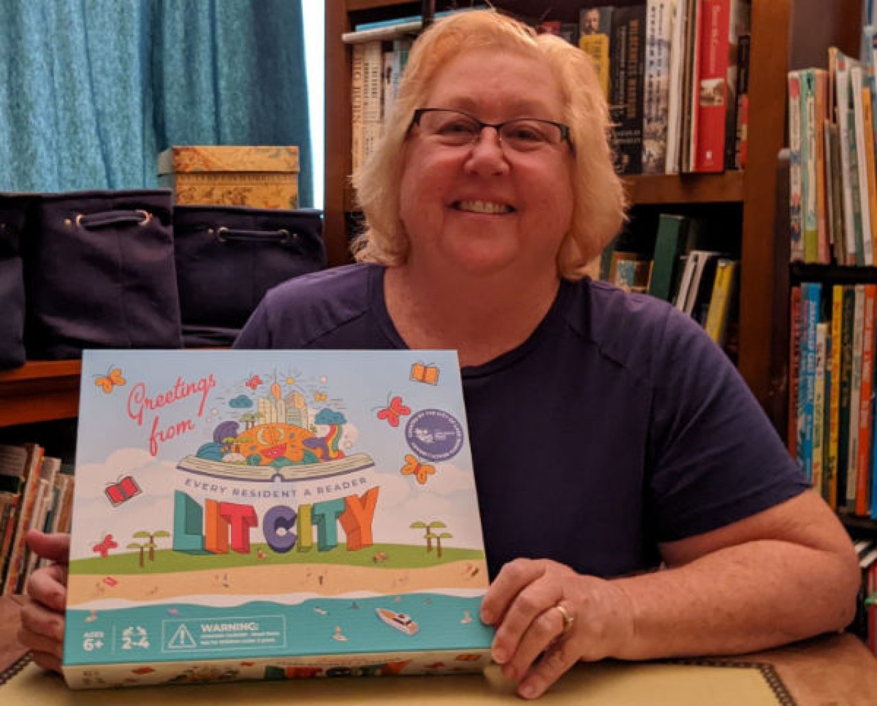 Cindy Ansell with Lit City Game box.
